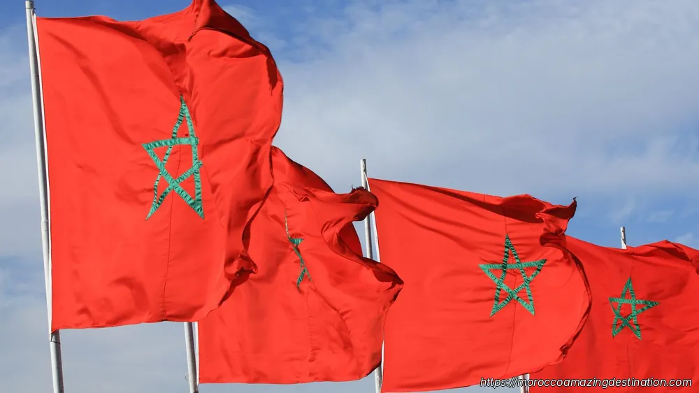 Discover the deep symbolism behind Morocco's red and green flag. Learn about the pentagram star, the Alaouite dynasty, and the history of the Moroccan flag.