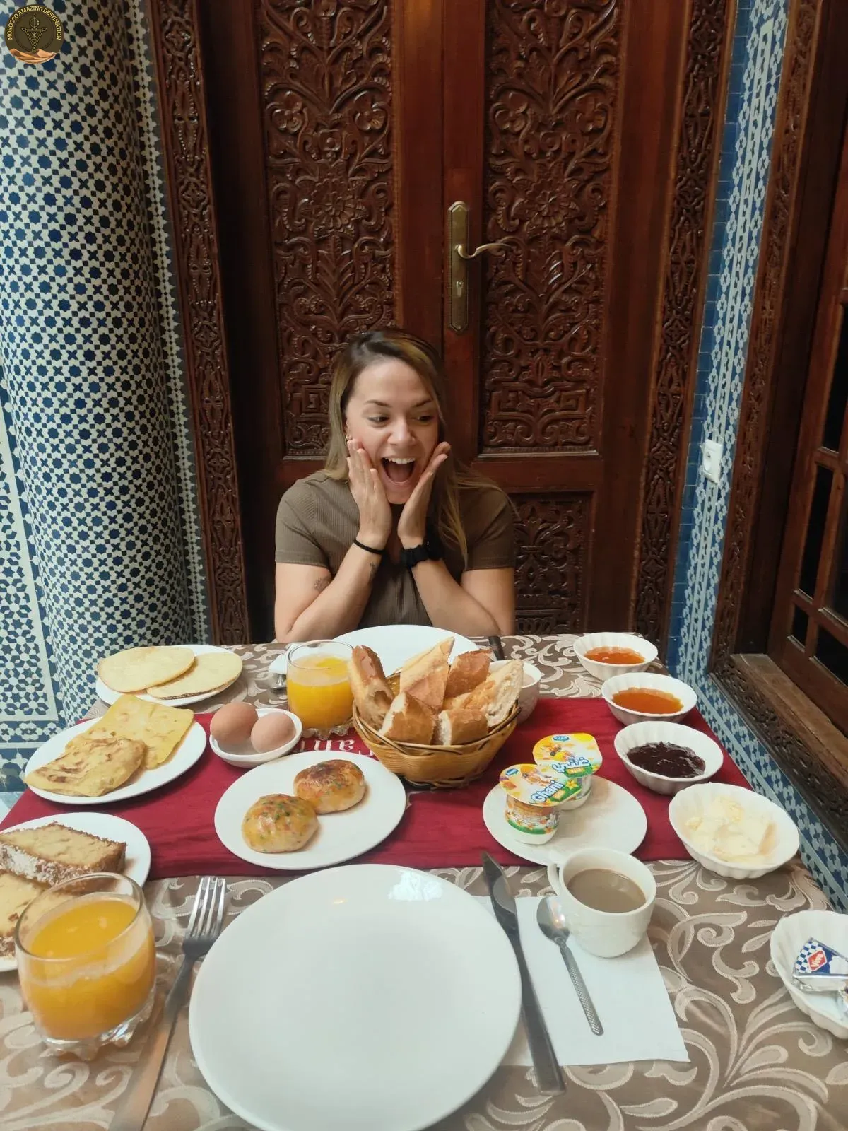 Moroccan breakfast spread with msemen, honey and mint tea