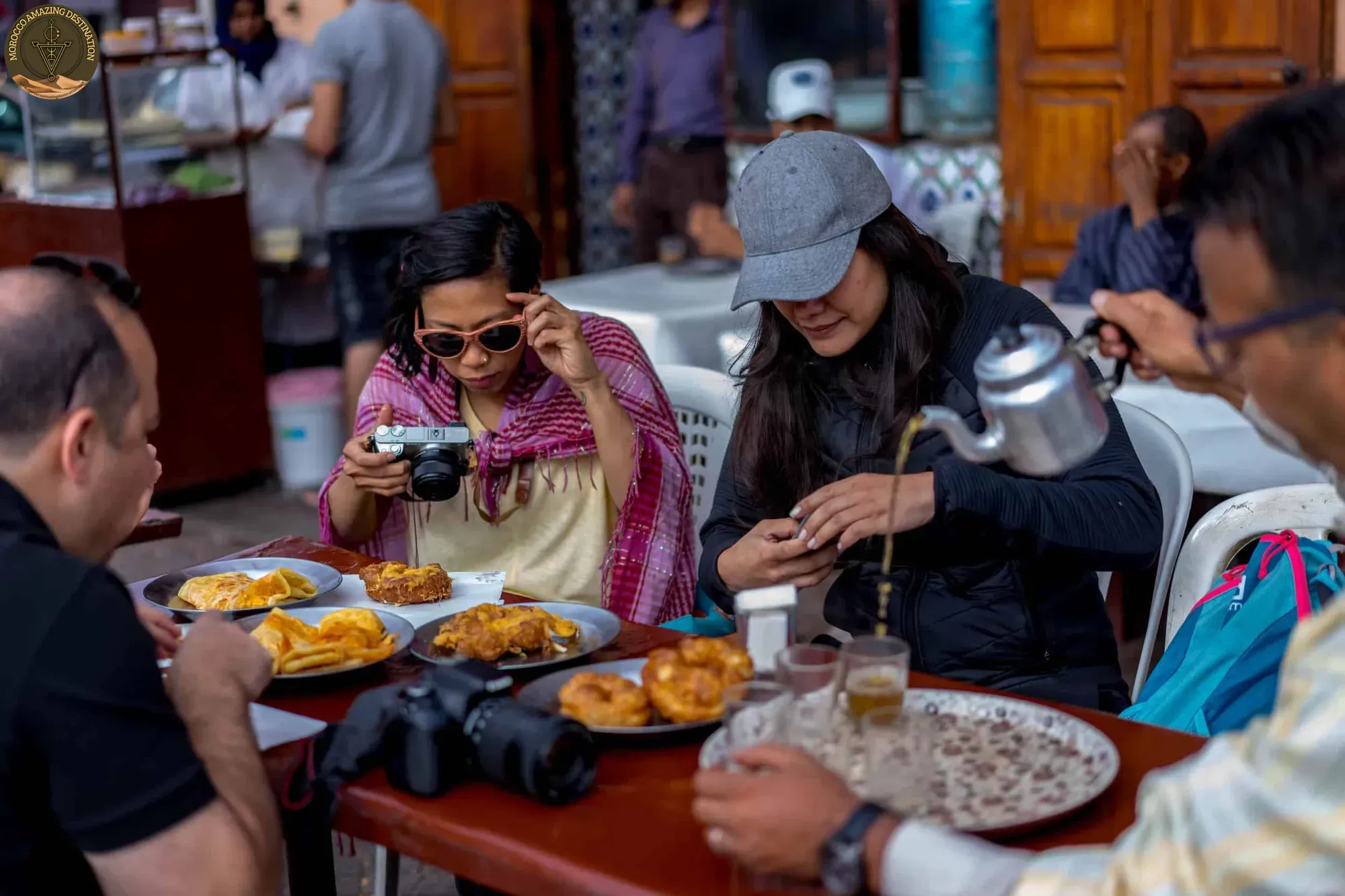 Moroccan street food stall with fried snacks and fresh bread